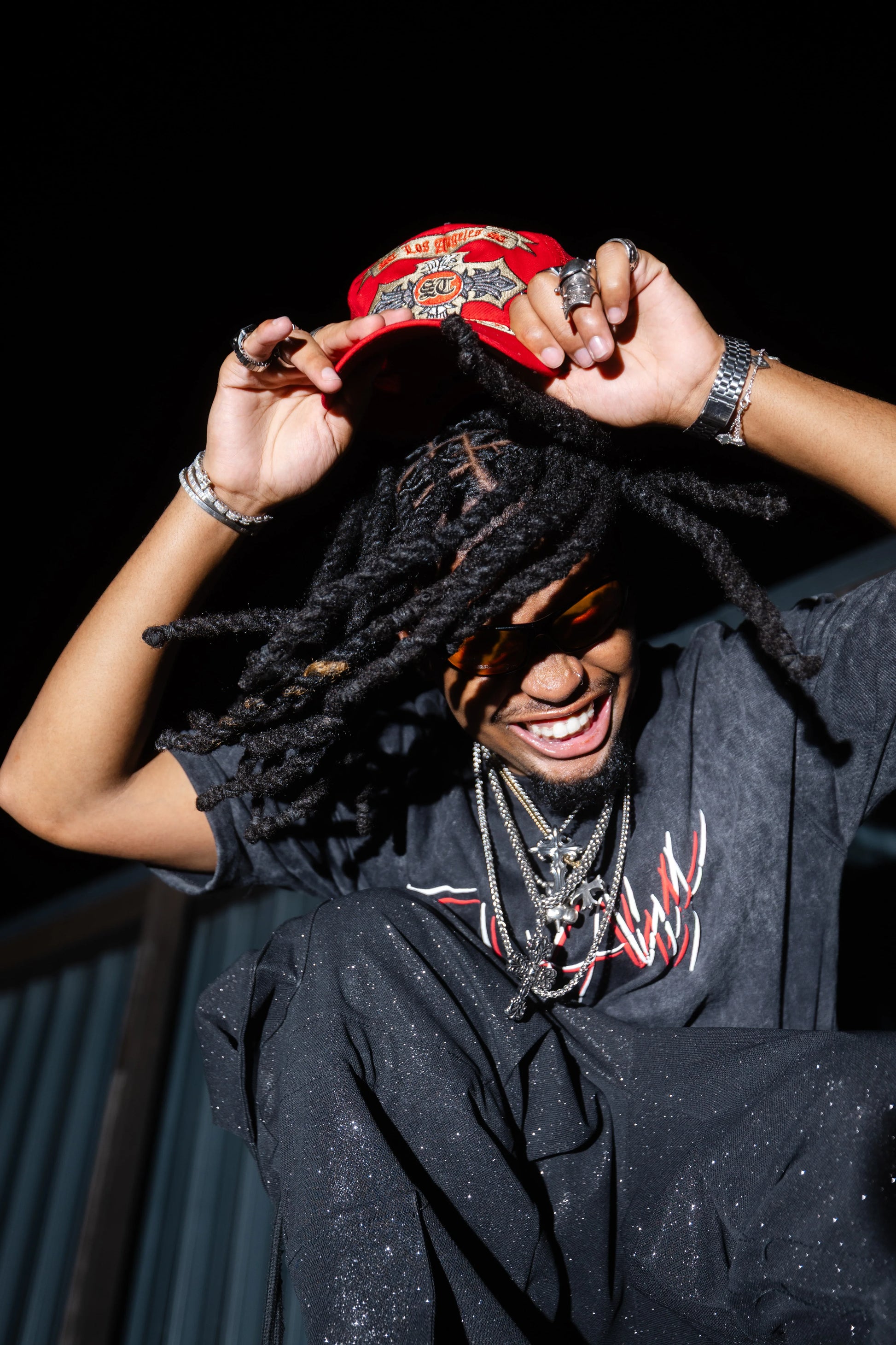 Oversized acid-washed black heavyweight tee with red and white "Do You See Me" graphic on front.