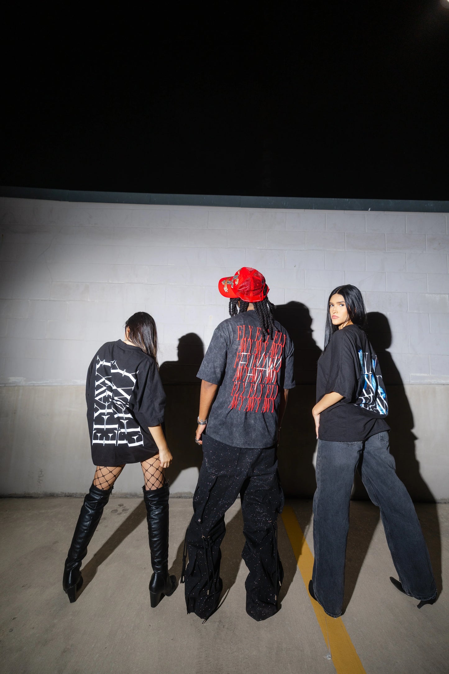 Black oversized heavyweight cotton tee with bold white graphic text on back and relaxed streetwear fit.