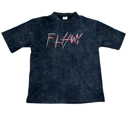 Oversized acid-washed black heavyweight tee with "FLYAWY" red and white graphic text on front.